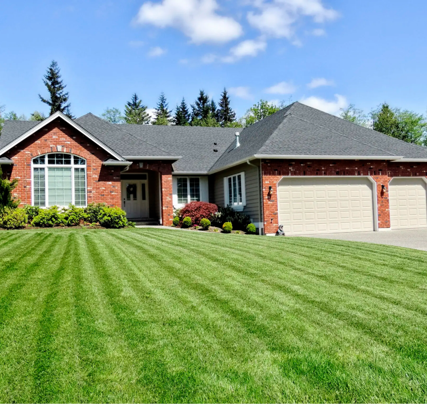 Modern suburban house with manicured lawn.